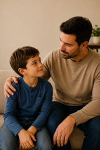 Father reassuring his son with a warm smile, showing that children are more honest when they feel safe telling the truth.